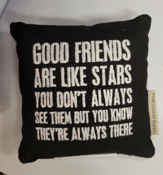 black embroidered pillow with white lettering good friends quote