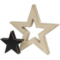 a small black star cutout next to a larger cream colors star cutout