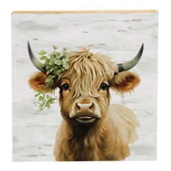 highland cow with flowers on barnboard background