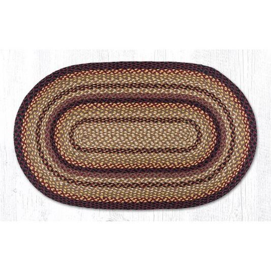 white background with oval rug in dark red, cream, and mustard