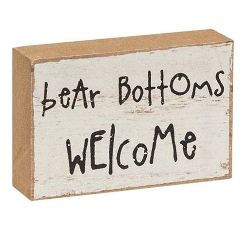 small white block with the words bear bottoms welcome 