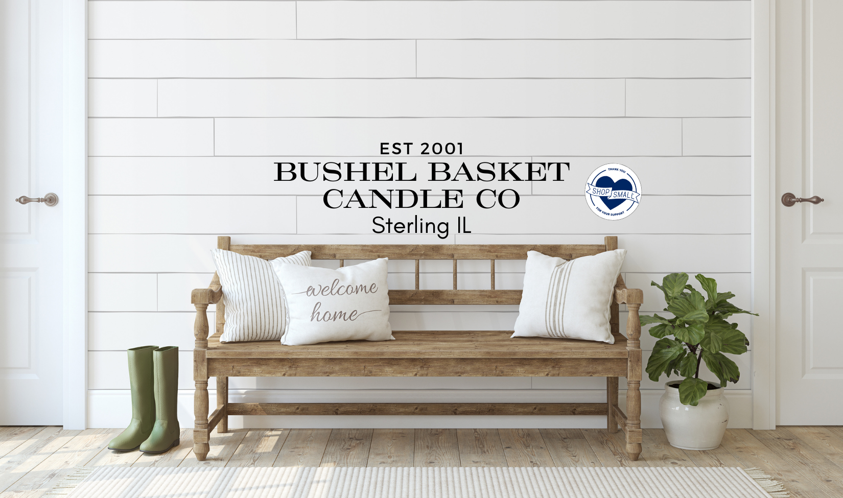 Wood bench under the Bushel Basket Candle Co lettering, displaying farmhouse and country decor